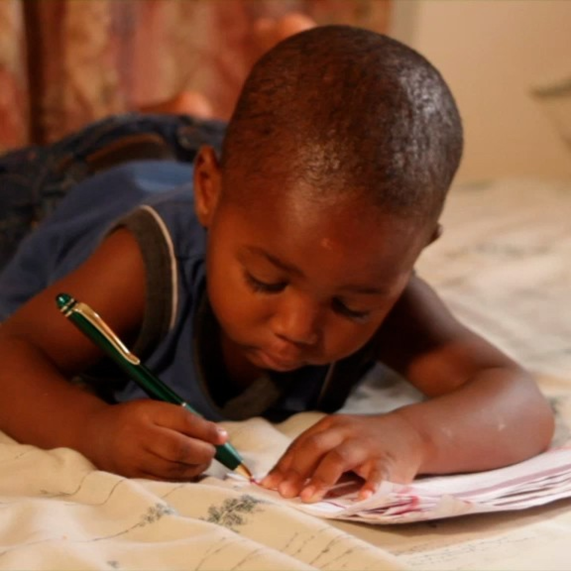 A young child drawing representing DMI's focus on ECD for this project