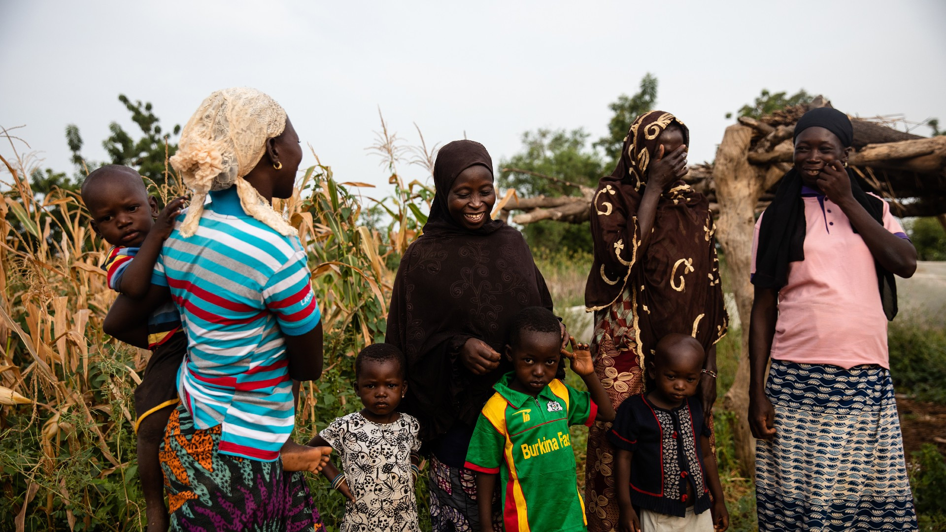 Women and children laughing in rural Burkina Faso